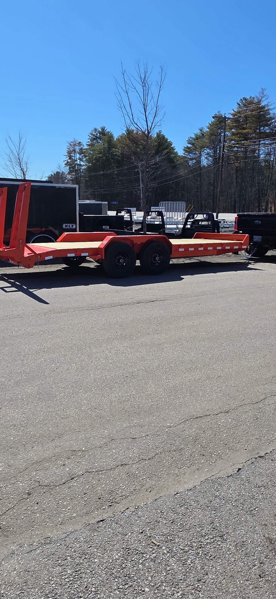 Patriot Liquidating's equipment hauling trailer — used to transport vehicles, machinery, and large equipment from sellers' locations.